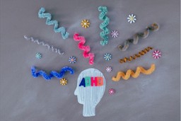 Alternative ADHD Treatment. Image is of a light coloured-in profile silhouette, with the word 'ADHD' written on it. The letters are different colors: blue, green, pink and orange. Fanning out above the head are squiggly lines made of pipe cleaners and little floral decorations, all of varying colours.