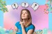 Psychedelic Substances. A dreamy pink background, with a blue border and soft-textured flora dotted around it. There is a female presenting person wearing a blue shirt, looking upward with their and beneath their chin, in contemplation, There are 3 question marks in speech bubbles above their head.