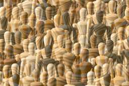 Race And Psychedelics. A sea of wooden figures of various races. There is a slight psychedelic pattern effect over the image.