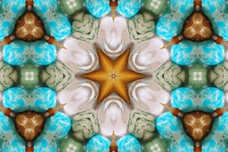 Altered states of consciousness. A dreamlike technicolor kaleidoscope of turquoise, earthy greens, browns, and some other earthy colours. A digitally designed modern boho style crystal gemstone inspired mandala kaleidoscopic pattern.