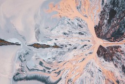 Overhead landscape photo of a pipe adding pink waste to a glacial landscape, by Ivan Bandura