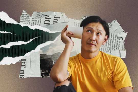 Daily gratitude. The image features a man in a bright yellow shirt seated against a textured background made of torn newspaper clippings and abstract collage elements. He holds a paper cup to his ear, suggesting he is listening intently, with a curious, contemplative expression. The backdrop includes layered scraps of text, torn paper edges, and a muted palette of earthy tones—greens, beiges, and off-whites—contrasting with the man’s vibrant shirt. The overall composition blends analog and surreal styles, evoking themes of communication, introspection, and the search for meaning.