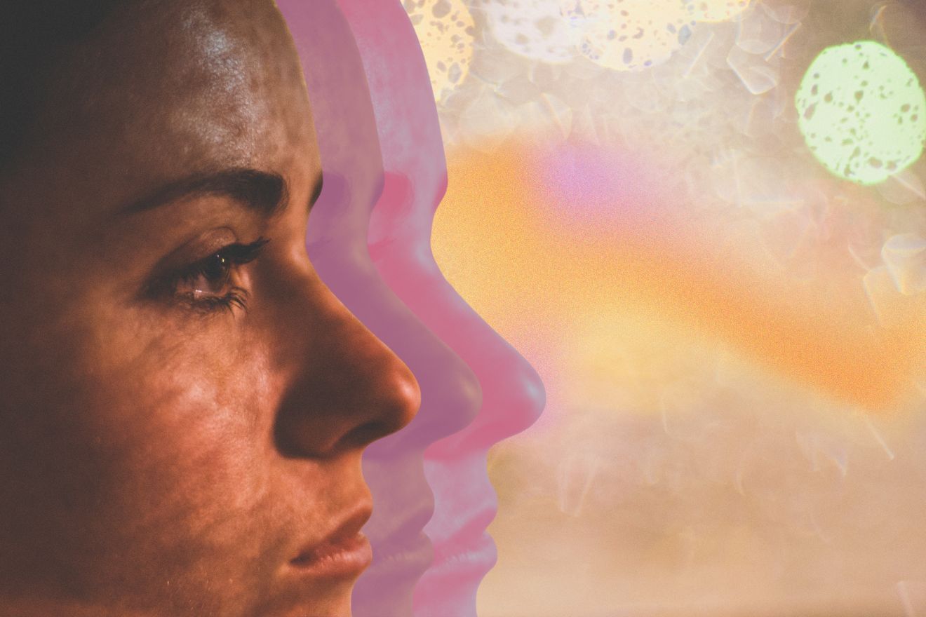 Altered states. Close-up profile of a person with layered translucent silhouettes of their face, set against a dreamy, abstract background of soft pink, gold, and cream tones, evoking altered states of consciousness and introspection.