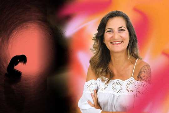 Spiritual Emergency. The image features a striking visual contrast between darkness and light. On the left side, a silhouetted figure kneels in apparent distress within a tunnel-like, reddish-black space, evoking a sense of emotional struggle or crisis. The right side transitions into a bright, warm palette of orange, pink, and soft white tones, where a smiling woman in a white eyelet top stands confidently, symbolizing healing, transformation, and joy. The background creates a gradient from shadow to light, reinforcing the journey from a spiritual emergency to recovery and empowerment.