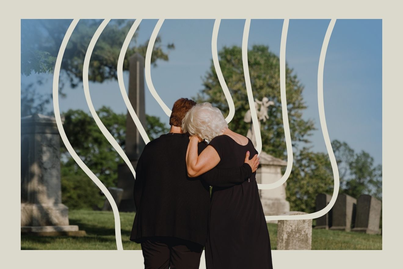 Psychedelics and grief. This image depicts two older people dressed in black, standing in a cemetery with gravestones and trees in the background. They are embracing each other in a gesture of comfort, their backs to the viewer, suggesting a moment of shared mourning or remembrance. The color palette is muted, dominated by earthy tones and soft greens, with the black clothing contrasting against the lighter background. A unique compositional element is the series of curving white lines that cut through the image, creating a wave-like distortion over the background scenery. This effect adds an abstract, introspective quality, perhaps evoking a sense of time passing or memories shifting. The framing of the lines emphasizes the solemn, intimate moment, drawing the eye to the figures and reinforcing the emotional depth of the scene.