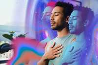 Holotropic Breathwork. A man with closed eyes and a hand on his chest is shown in a soft, surreal composition with layered translucent duplicates and swirling pink, blue, and purple cosmic-style colors around him.