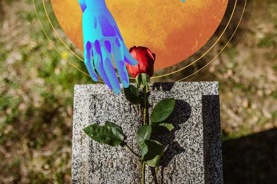 Fear of death. A top-view photo of a grave with a single red rose on it. There is a graphic of a golden sun-like orb on the top side of the photo next to the grave, and from the same side, a graphic of a psychedelic blue hand reaching out, having presumably placed the rose.